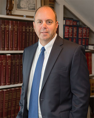 photo of attorney David V. Parnoff in his library